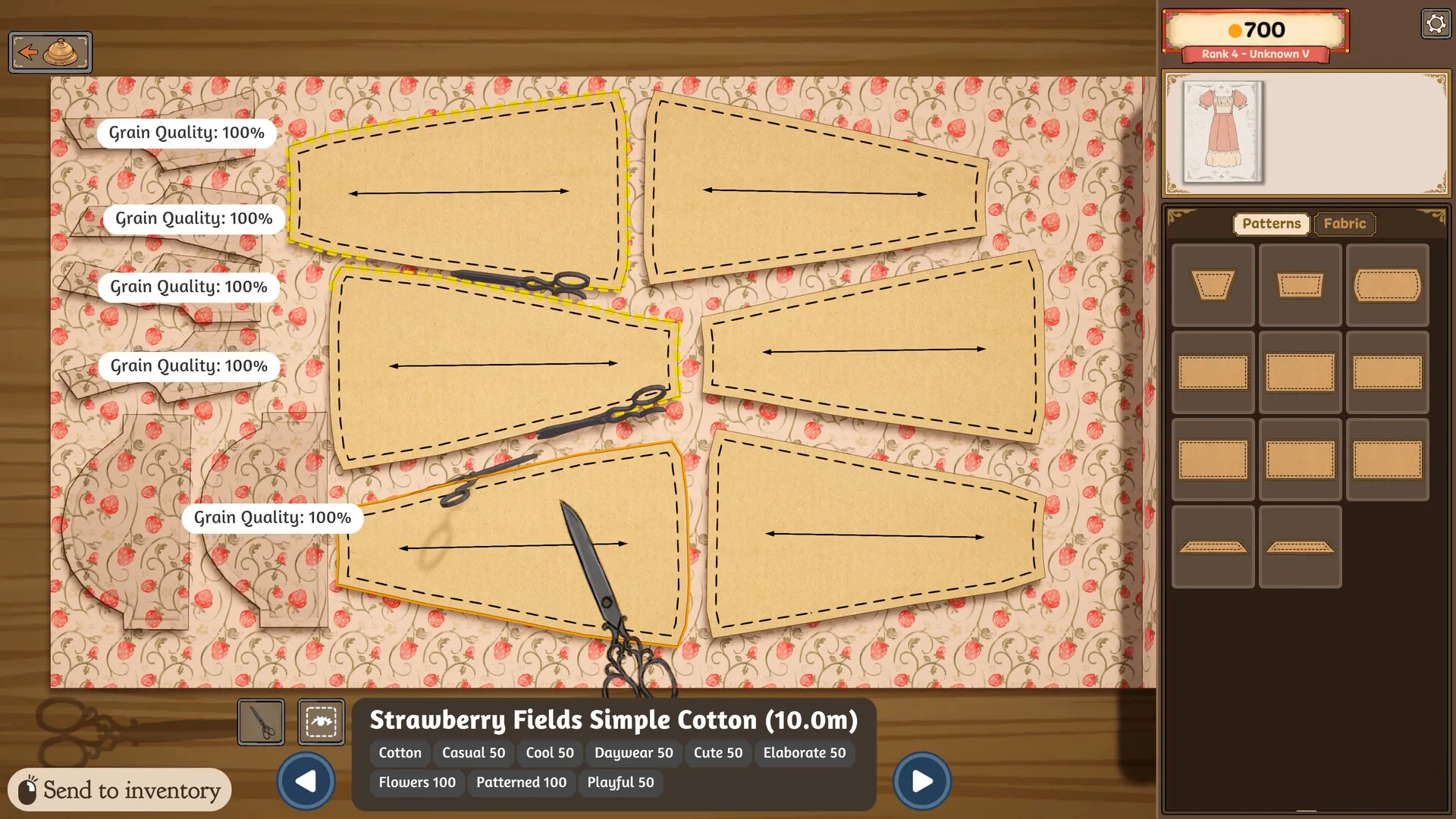 Paper pattern pieces on strawberry-print cotton, each with a horizontal arrow, several labelled Grain Quality: 100%.